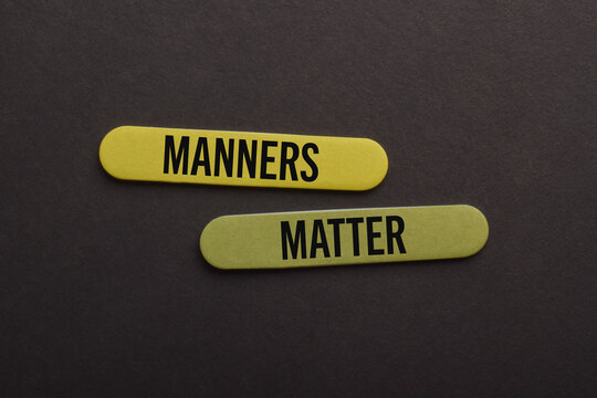 Wooden sticks labeled Manners Matter on a dark background, symbolizing etiquette, respect, courtesy, communication, professionalism, social behavior, and positive conduct.