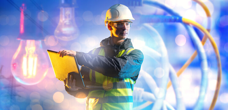 Energy industry, electrical engineer monitors power systems using a laptop at an energy facility, controlling electricity supply and infrastructure.