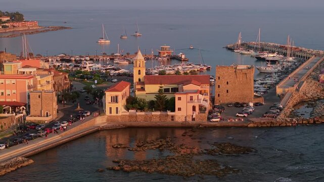 Acciaroli Cilento drone 70mm telephoto sunset view harbor historic complex Italy, hidden gem Southern Italy, golden hour background compression, watchtower church marina panorama Cinematic 4K footage