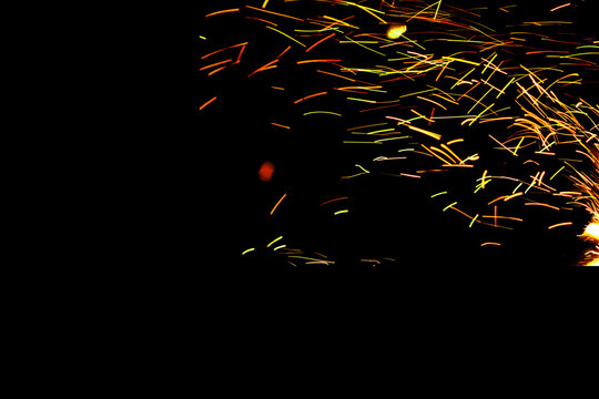 Abstract flame background with warm orange and yellow light glow in the dark