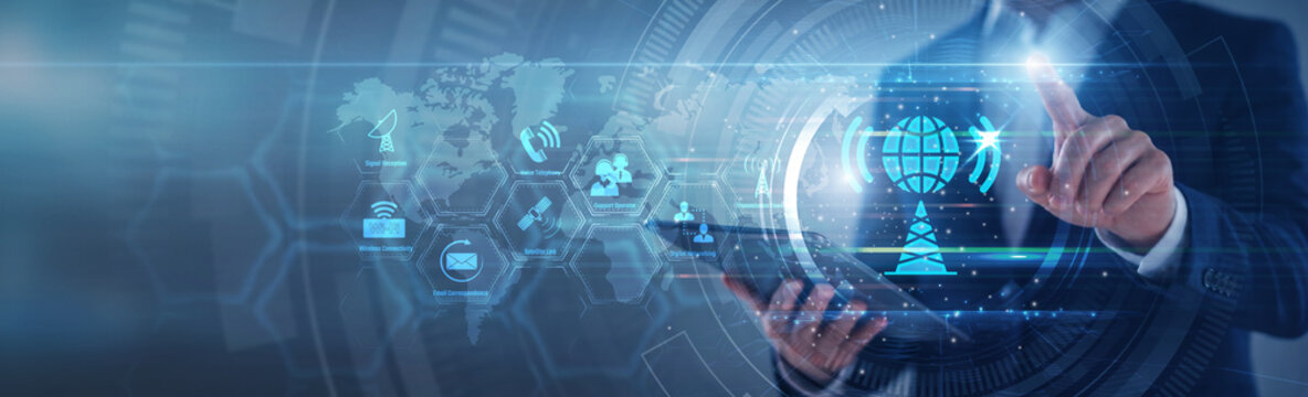 Network engineer pointing telecommunications infrastructure. Expert using tab analyzing wireless signal coverage and fiber optic network data on hologram. Technology and telecommunications.