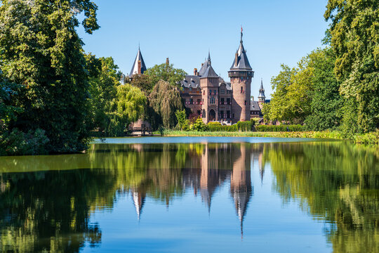 Haar Castle facade reflected on a lake
