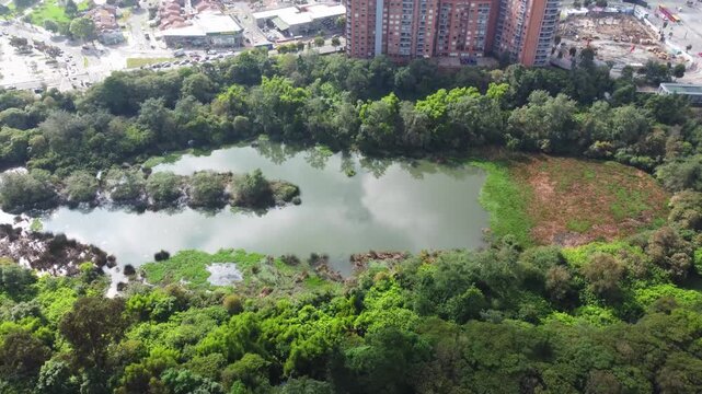 Aerial view wetland Cordoba and Suba road, cars moving Bogota, Colombia 4k