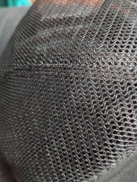 Close-up detail of breathable mesh textile pattern and structure