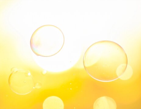 白と黄色の光の中に浮かぶ大小のシャボン玉