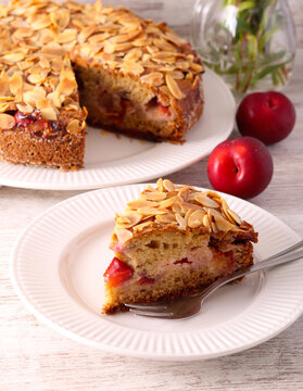 Homemade whole wheat plum cake with almond topping