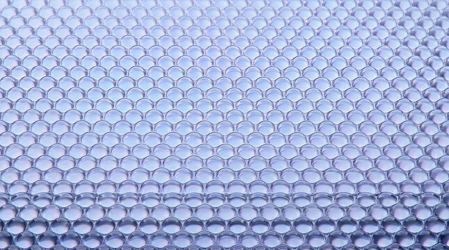Abstract Geometric Pattern: A close-up, abstract view of a tessellating geometric pattern formed by many small, circular, transparent bubbles.