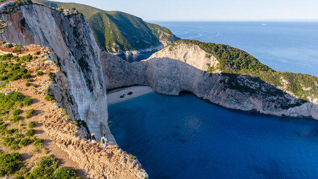 Breathtaking views of Navagio Beach in Zakynthos, Greece surrounded by stunning cliffs