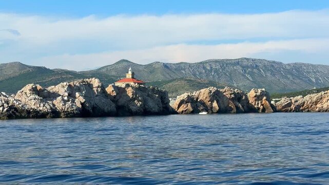 Grebeni Lighthouse on the Grebeni Islets near Dubrovnik in Croatia on the Adriatic Sea. Historic maritime navigation landmark guiding vessels along the Dalmatian coast.