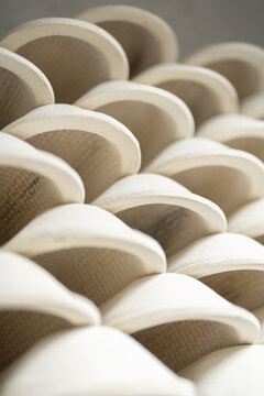 Lot of clay forms for baking lie on each other