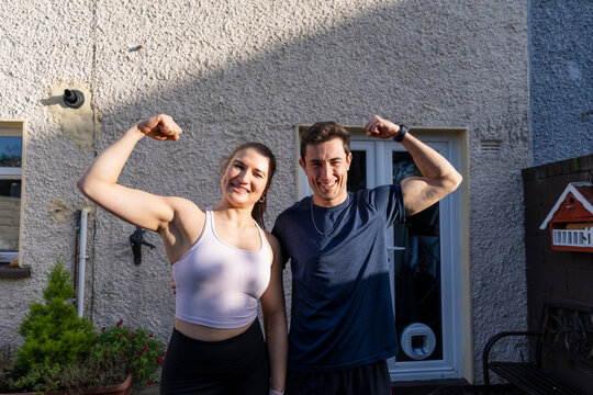 Couple training together in backyard for fitness and health