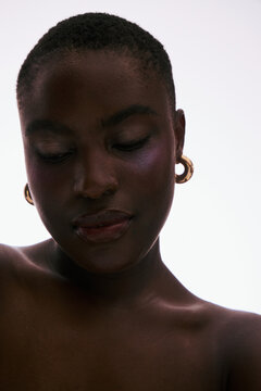 Portrait of a Person With Earrings in a Minimalist Setting