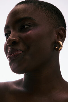 Portrait of a Woman With Short Hair Wearing Large Earrings