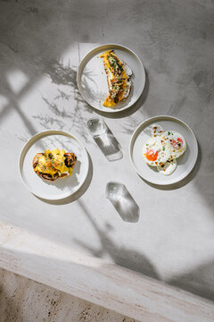three plates with eggs