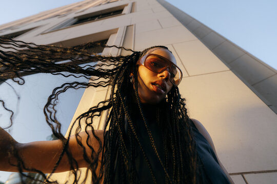 Braids Flying Urban Sunset Portrait