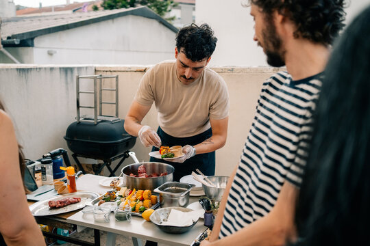 Cooking Demonstration on a Terrace With a Chef Preparing Food