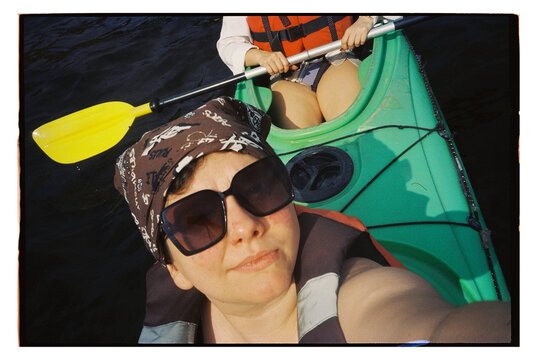 Kayaking on a lake during a sunny day in summer