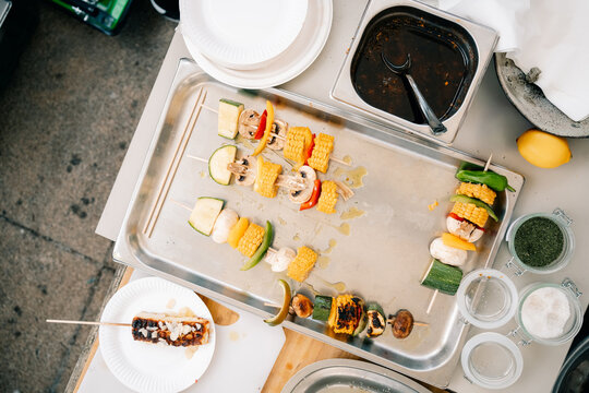 Grilled Vegetables and Skewers at a Food Stall During the Day
