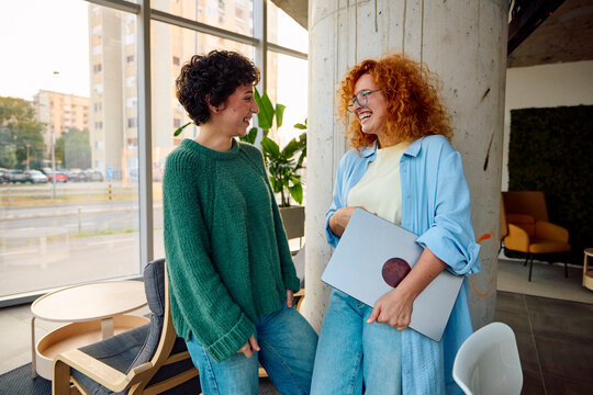 Classmates talking indoors