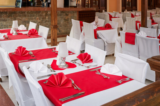 Indoor banquet hall tables prepared for a wedding reception
