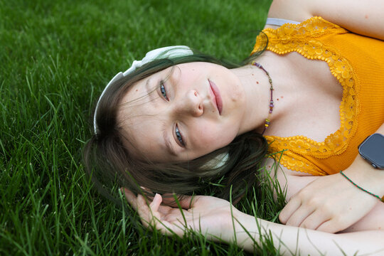 teenage girl wearing headphones