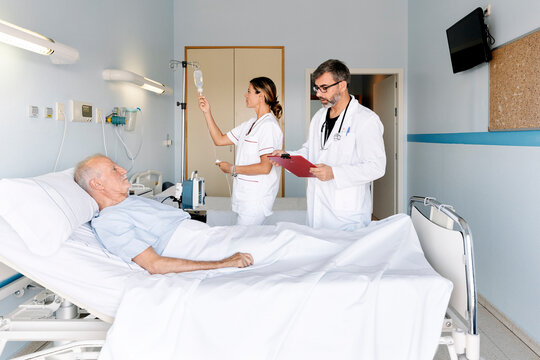 Healthcare team caring for senior man in hospital