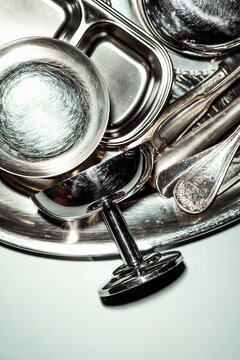 Different Metal Kitchen Items on a Tray for Cooking and Serving