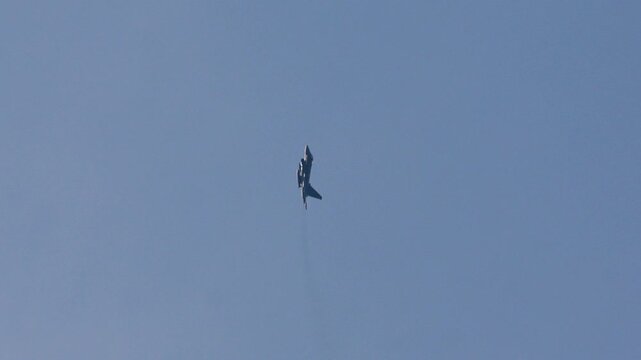Military fighter jet performing a Pugachev's Cobra maneuver