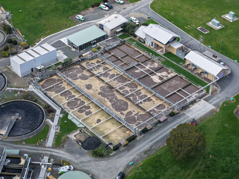 Lilydale, Victoria, Australia - 10 September 2026: Aerial view of the Lilydale Wastewater Treatment Plant with aeration tanks, industrial buildings, and surrounding green landscape.