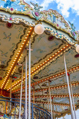 Vintage carousel roof with bright illuminated lights background © Mila