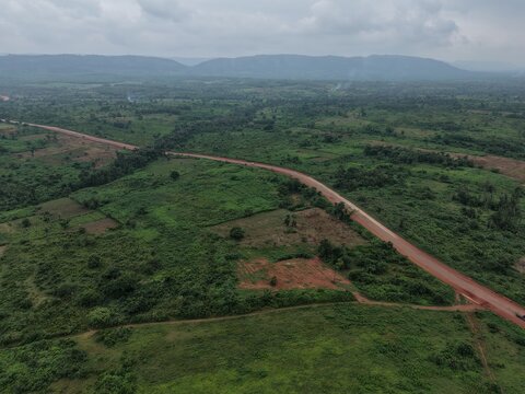 Itawure, Ekiti, Nigeria - 21 August 2026: Aerial view of Erimo-Effon Alaiye Road winding through the lush green landscape of Ekiti state under a cloudy sky.