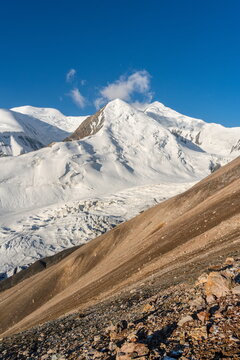 Snow peak and glacier seen from Yukhin Peak slopes in Kyrgyzstan, August