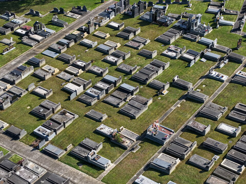 Ferntree Gully, Victoria, Australia - 09 September 2026: Aerial view of Ferntree Gully Cemetery featuring rows of stone graves and monuments set within a well-maintained grassy landscape.