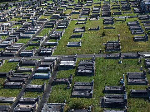 Ferntree Gully, Australia - 09 September 2026: Aerial view of Ferntree Gully Cemetery with rows of gravestones and monuments set in a well-maintained grassy landscape.