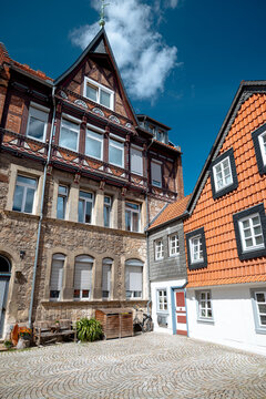 Wolfenbuttel, Germany - July 3, 2026: Weathered timber-framed house with exposed brick infill stands along a narrow street in the historic old town.