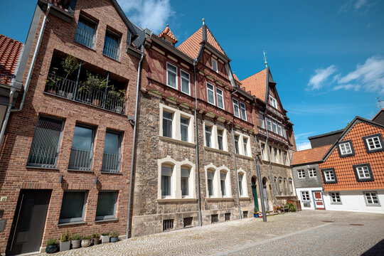 Wolfenbuttel, Germany - July 3, 2026: Weathered timber-framed house with exposed brick infill stands along a narrow street in the historic old town.