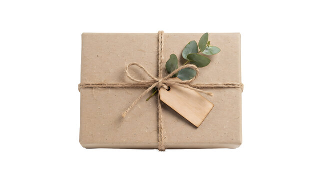 Gift box wrapped in brown paper with twine, a eucalyptus sprig, and a blank wooden gift tag isolated on transparent background