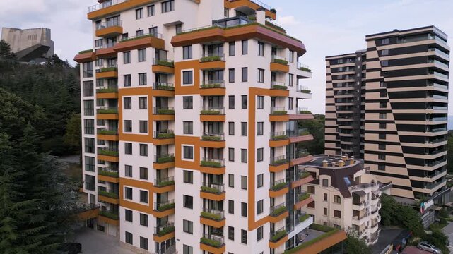 Modern Multi Story Apartment Building Facade Near Green Trees Aerial View