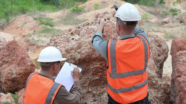 Engineers inspecting rocky construction site