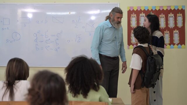 Teacher teaching students in classroom