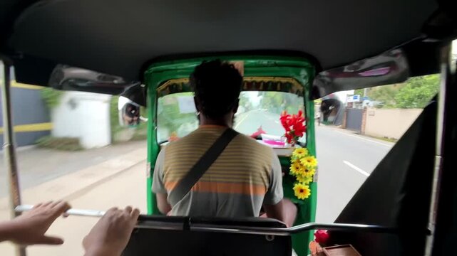 Early morning tuk tuk ride along coastal road in Sri Lanka.