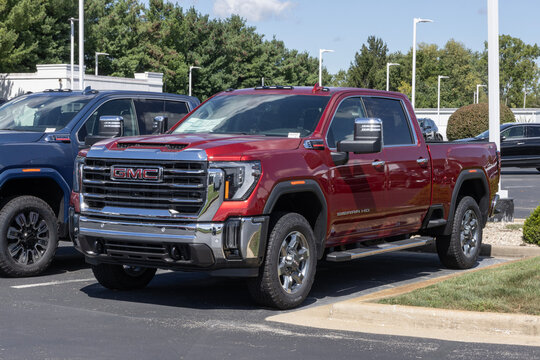 GMC Sierra 2500 4WD Crew Cab SLT truck display. GMC offers the Sierra 2500 with a 6.6L Duramax Turbo Diesel engine. MY:2026