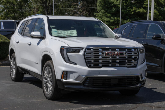 GMC Acadia Denali AWD Mid-Size SUV at a dealership. GMC offers the Acadia with a 2.5L Turbocharged DOHC engine. MY:2026