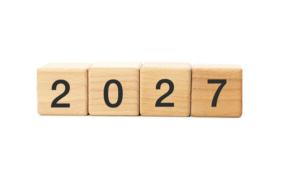 Wooden blocks displaying 2027 number isolated on white background for new year celebration concept
