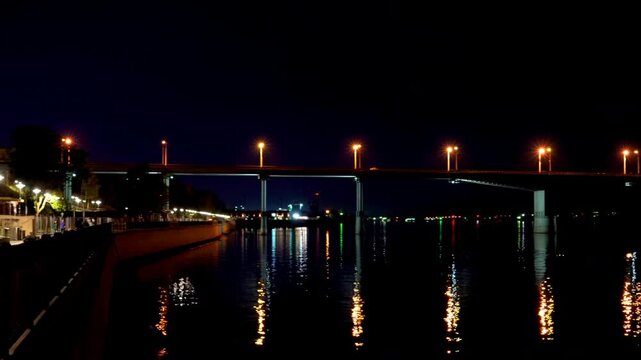 Perm, Russia. Communal bridge over the Kama river in Perm. Night view. The embankment