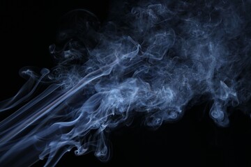 Obraz premium Beautiful smoke in light on black background