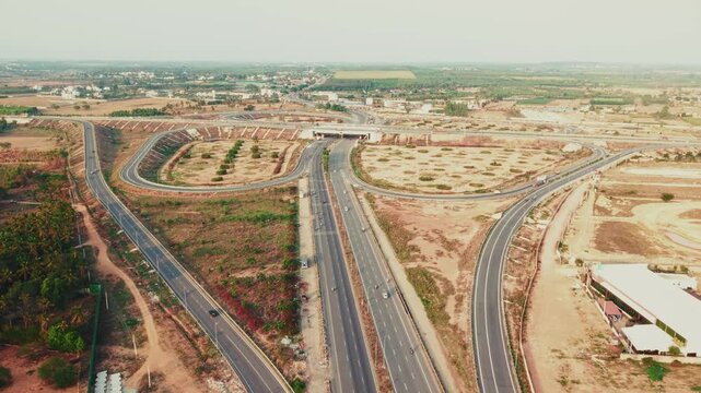  Aerial view of the new Bengaluru-Chennai Expressway cloverleaf interchange near Hoskote, India.
