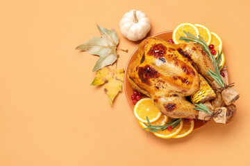 Thanksgiving day. Tasty baked turkey with orange slices, rosemary, pumpkin and leaves served on...