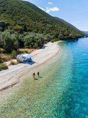 Stunning Kamari Beach in Lefkada Greece with clear waters and scenic mountain views
