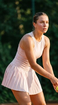 Female Tennis Player in Ready Position on Outdoor Court